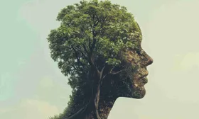 Profilo di testa umana formato dalla chioma di un albero verde